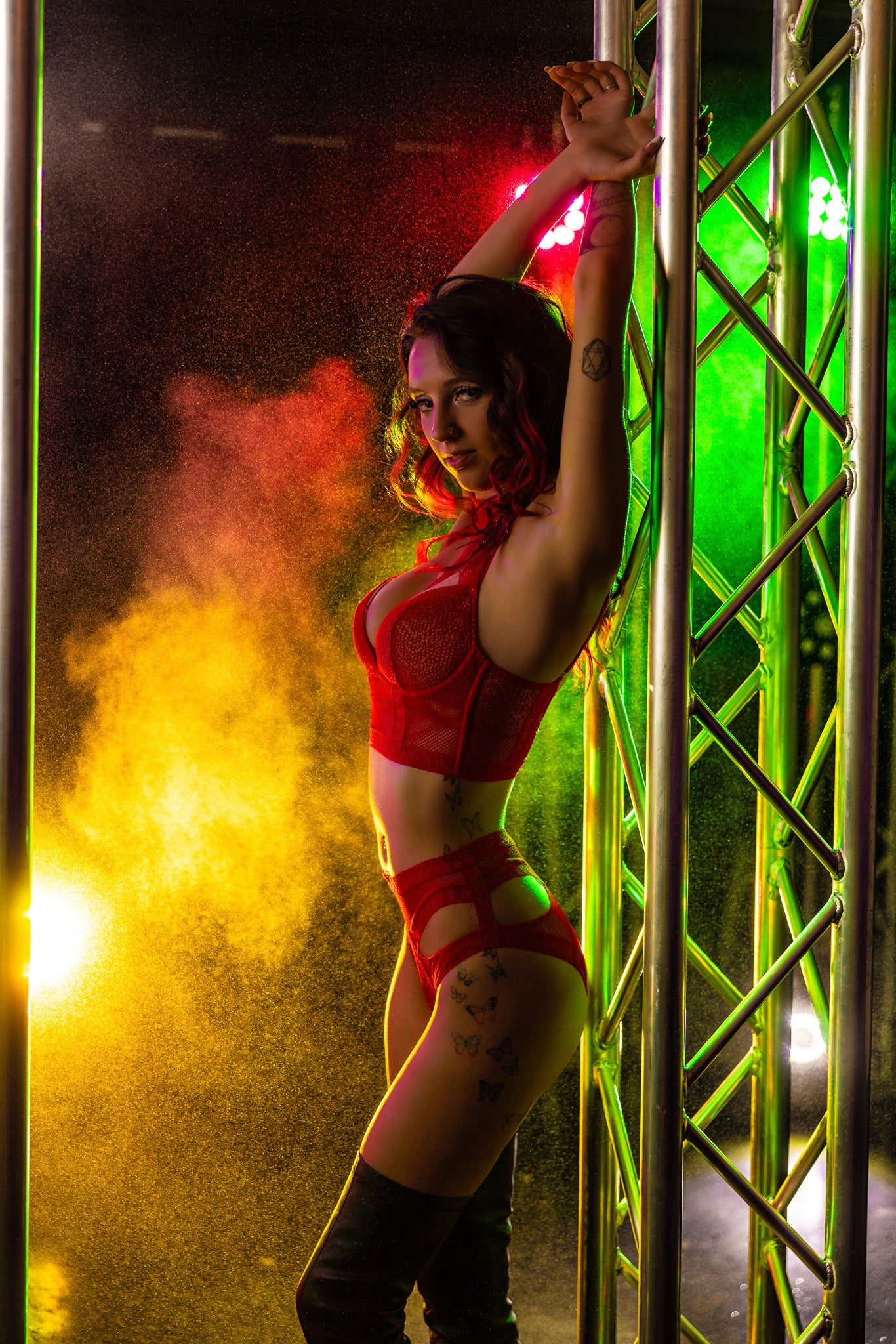 Stage-style boudoir portrait with yellow and red smoke lighting at Studio SJ in Neenah, Wisconsin.